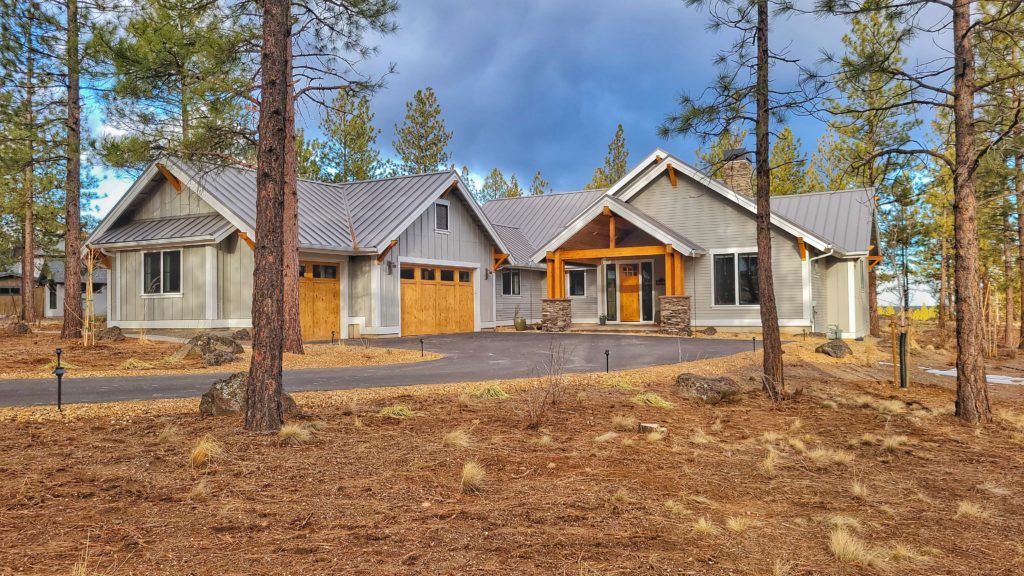 An inspiring image capturing the essence of Bend, Oregon, with its breathtaking landscapes, featuring potential lots for building custom homes nestled among lush forests and pristine rivers, highlighting the area's natural beauty and the promise of a dream home tailored to perfection.